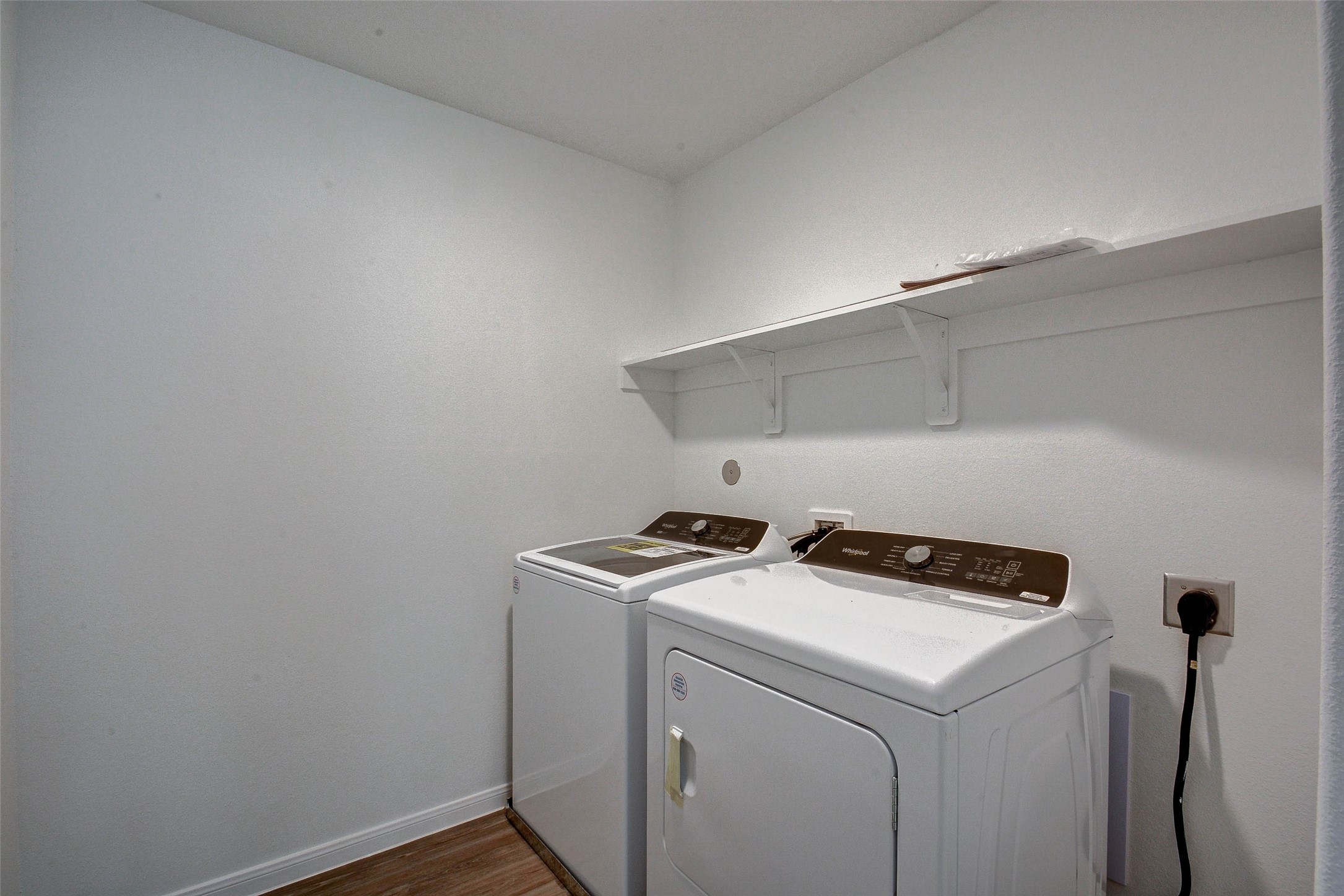 16642 Teak Mantle Road Conroe, TX 77302 - Photo 32 of 35 a utility room with dryer and washer