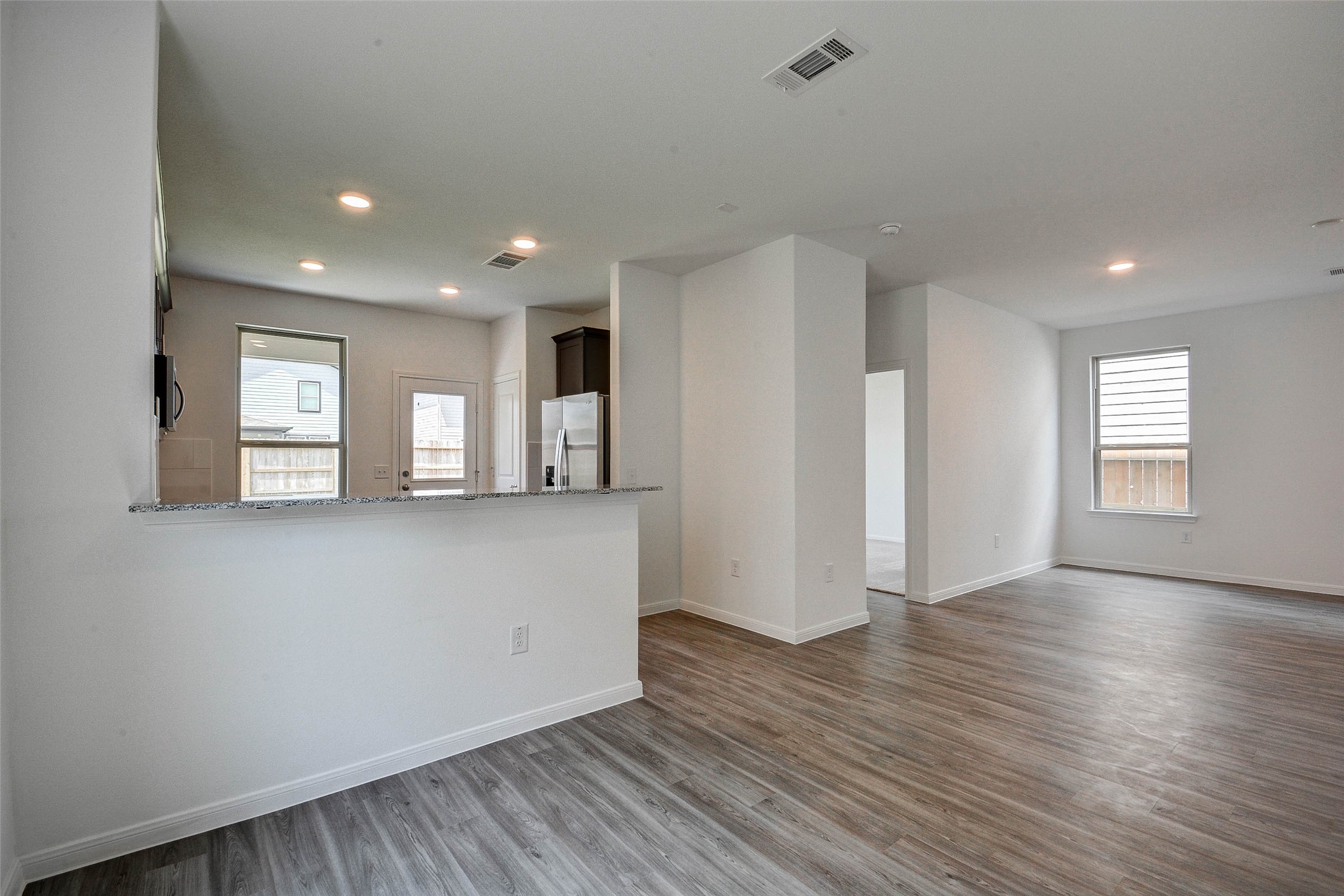 16642 Teak Mantle Road Conroe, TX 77302 - Photo 33 of 35 a view of empty room with wooden floor and window