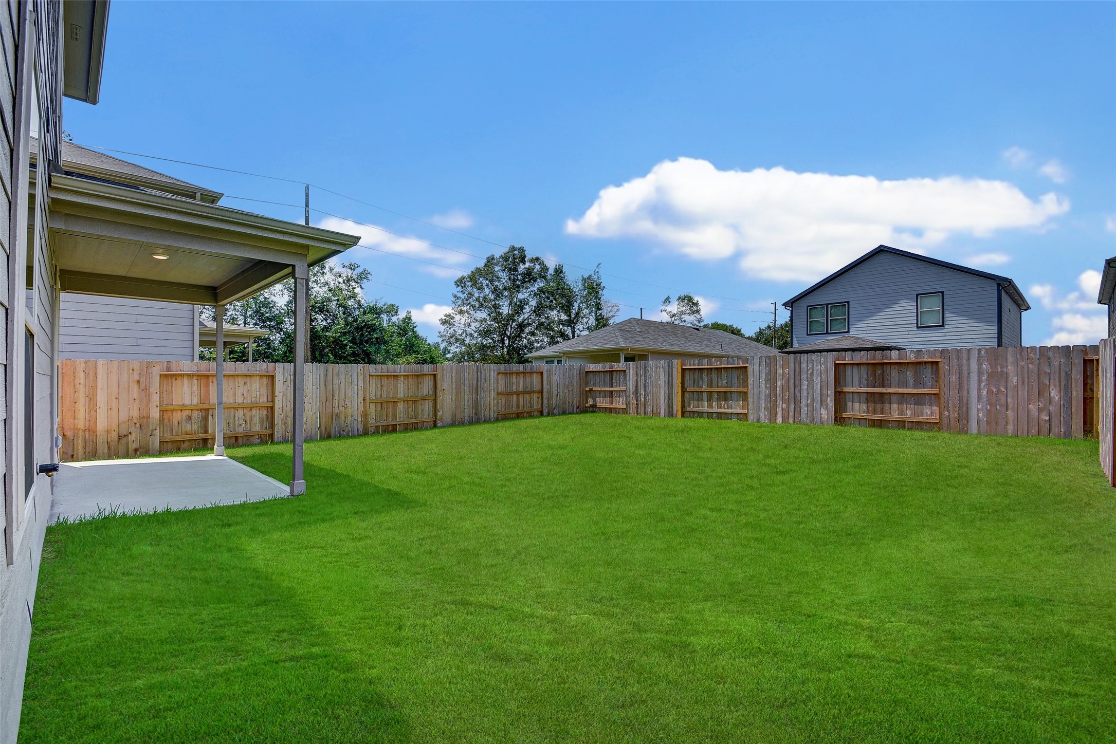 16642 Teak Mantle Road Conroe, TX 77302 - Photo 34 of 35 a view of a house with a backyard