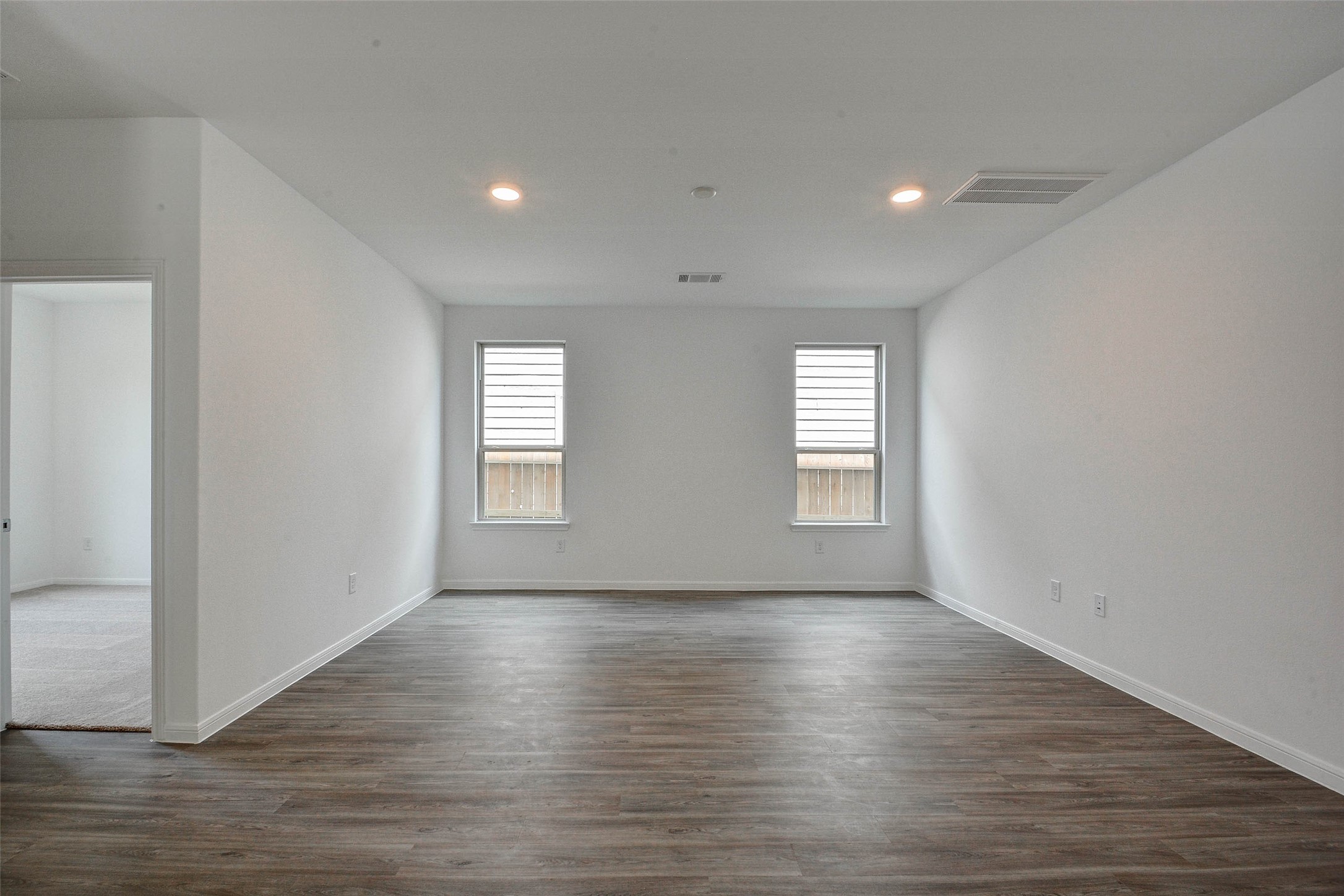 16642 Teak Mantle Road Conroe, TX 77302 - Photo 10 of 35 a view of empty room with wooden floor and fan