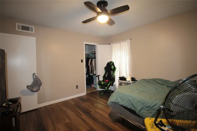 a bed room with a bed and a window