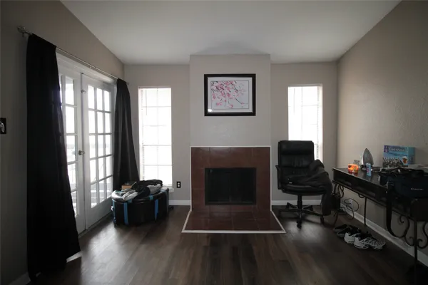 a livingroom with workspace and a window
