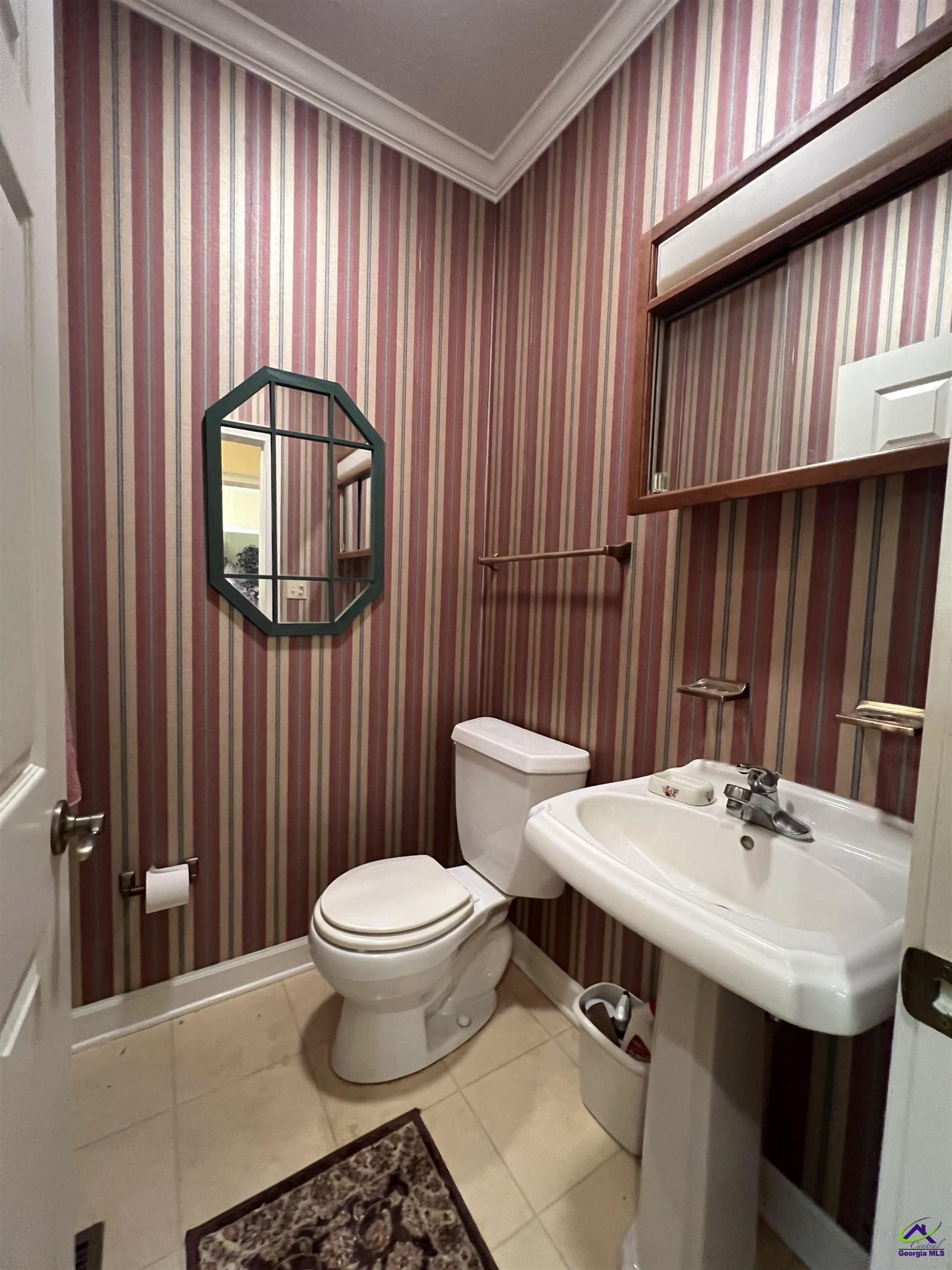 762 Nicholson-Carr Road Chester, GA 31012 - Photo 18 of 81 a bathroom with a sink a toilet and mirror