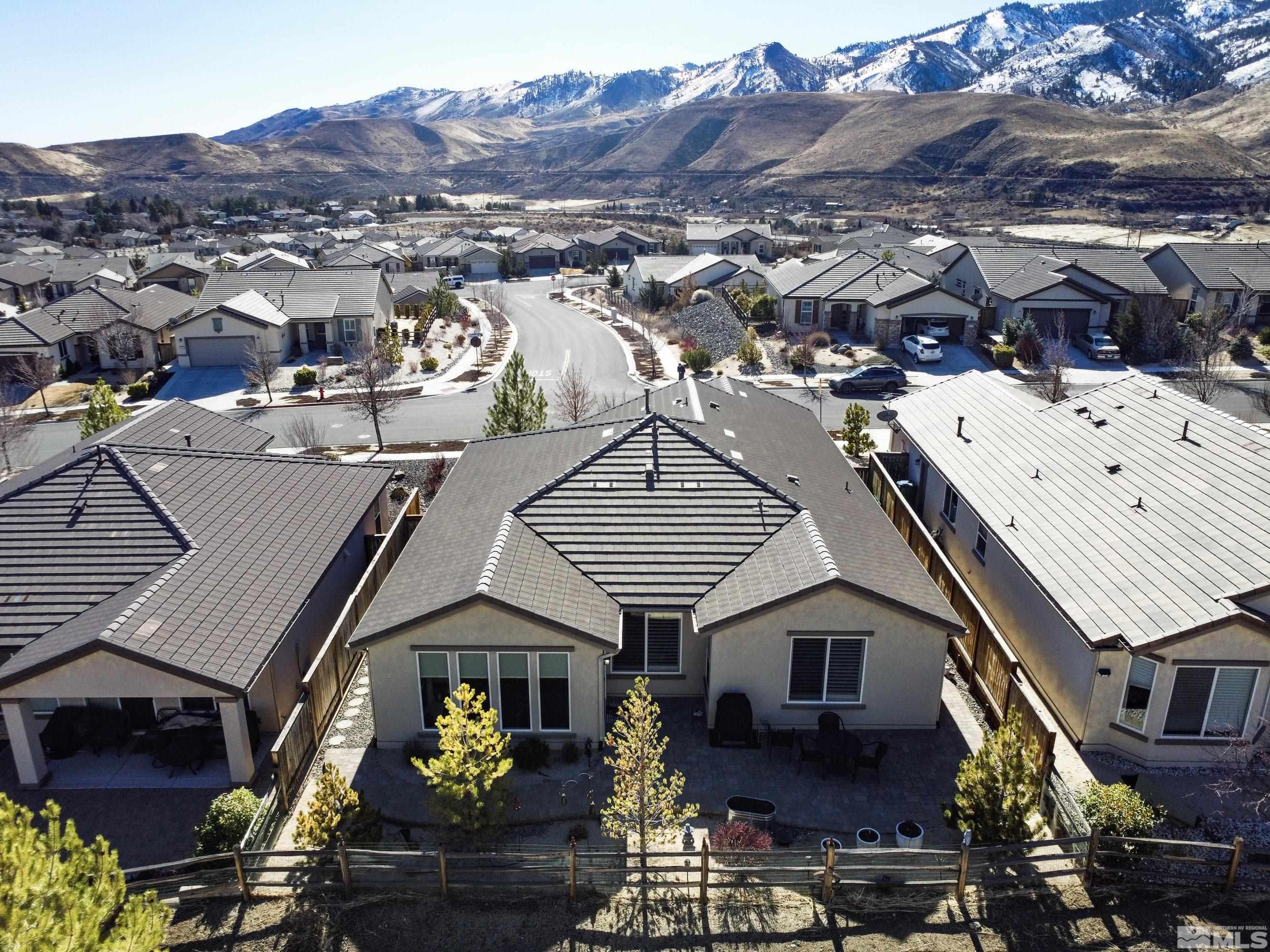 9255 Sassafras Trail Reno, NV 89523 - Photo 1 of 25 a view of a house with a swimming pool