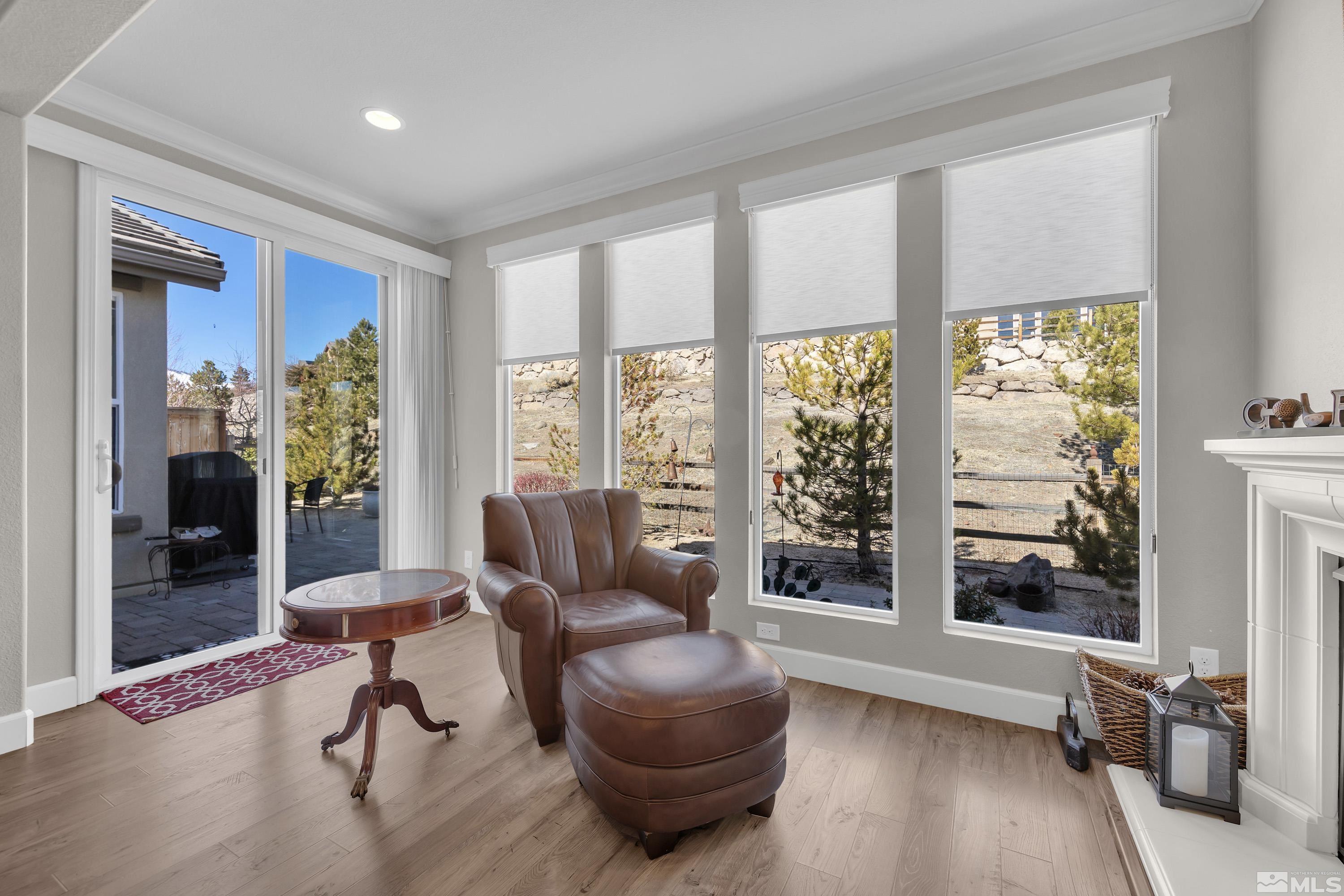 9255 Sassafras Trail Reno, NV 89523 - Photo 12 of 25 a living room with furniture and a floor to ceiling window