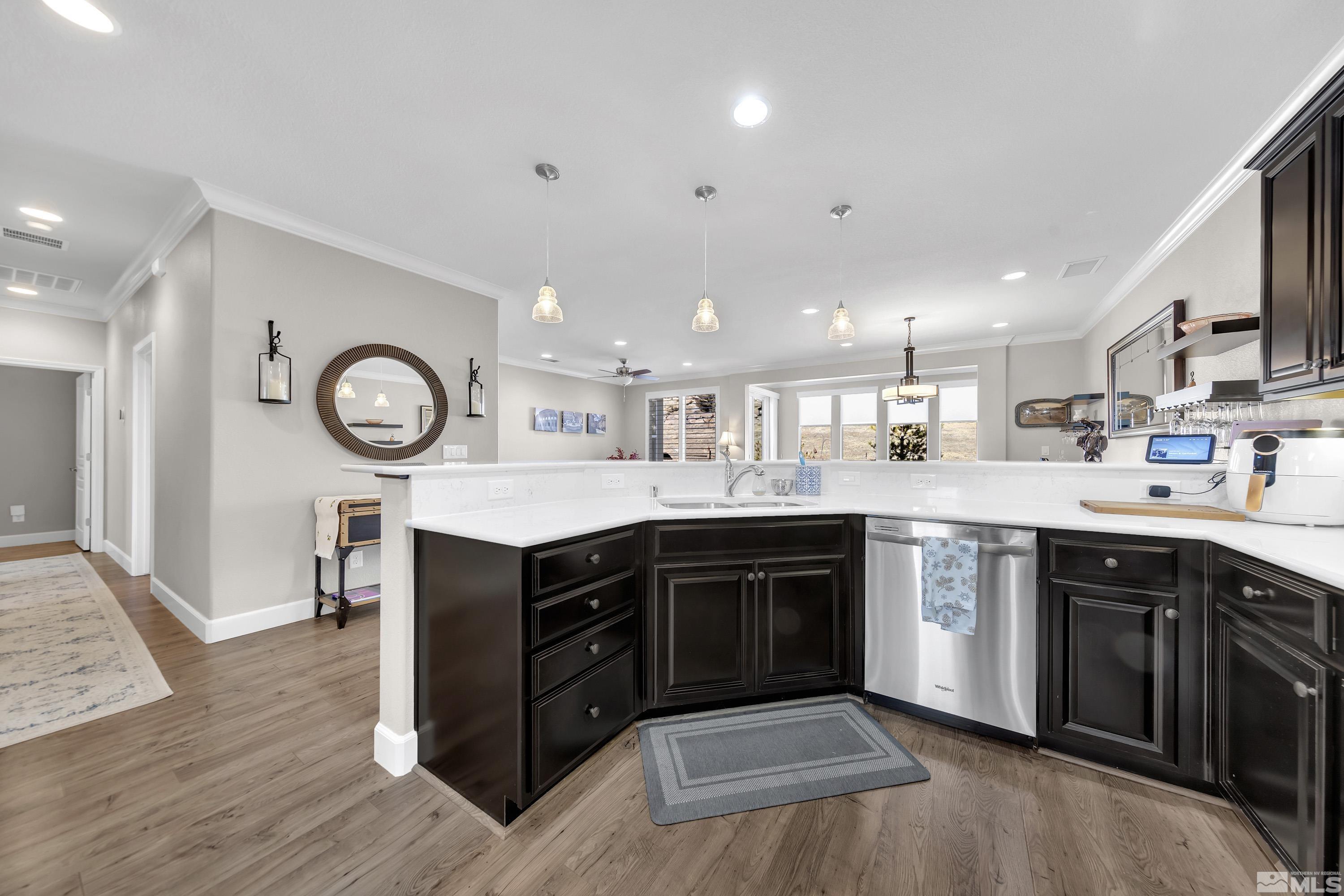 9255 Sassafras Trail Reno, NV 89523 - Photo 8 of 25 a kitchen with stainless steel appliances granite countertop a stove top oven a sink and a refrigerator
