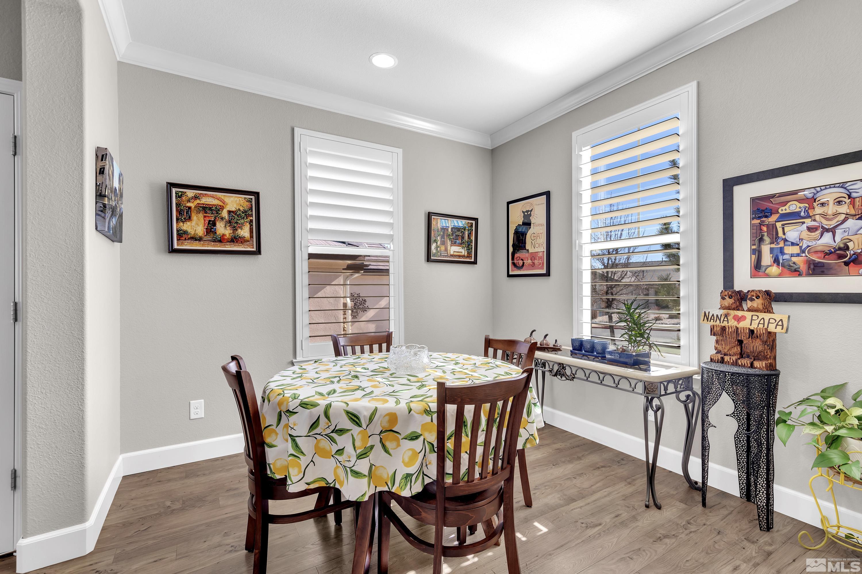 9255 Sassafras Trail Reno, NV 89523 - Photo 10 of 25 a view of a dining room with furniture window and wooden floor