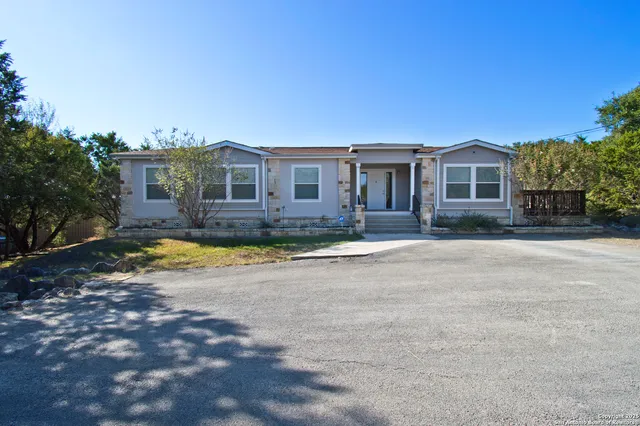 a view of house with a yard