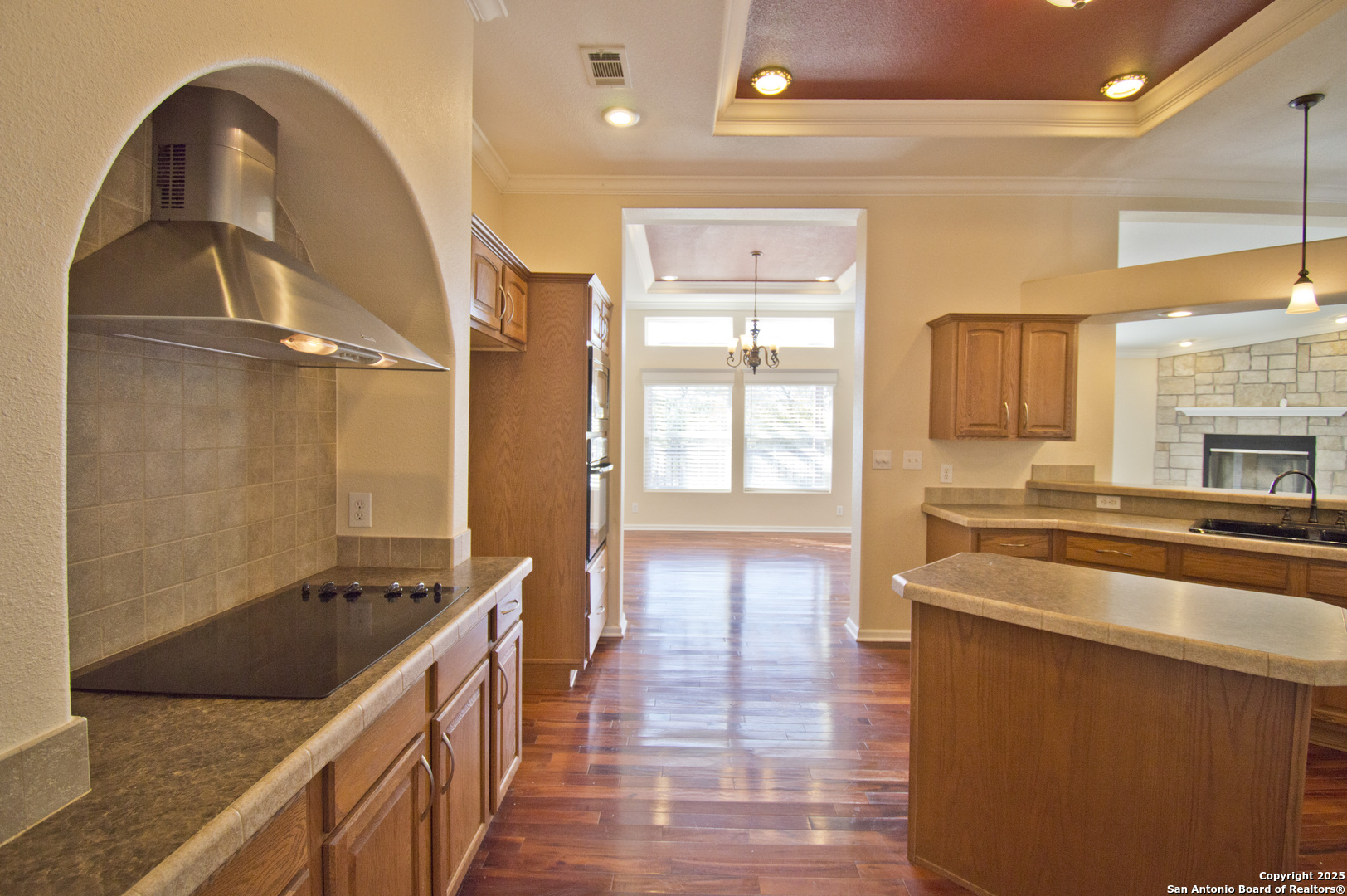 108 Fawn Drive Spring Branch, TX 78070 - Photo 11 of 31 a kitchen with stainless steel appliances granite countertop a stove a sink and a refrigerator