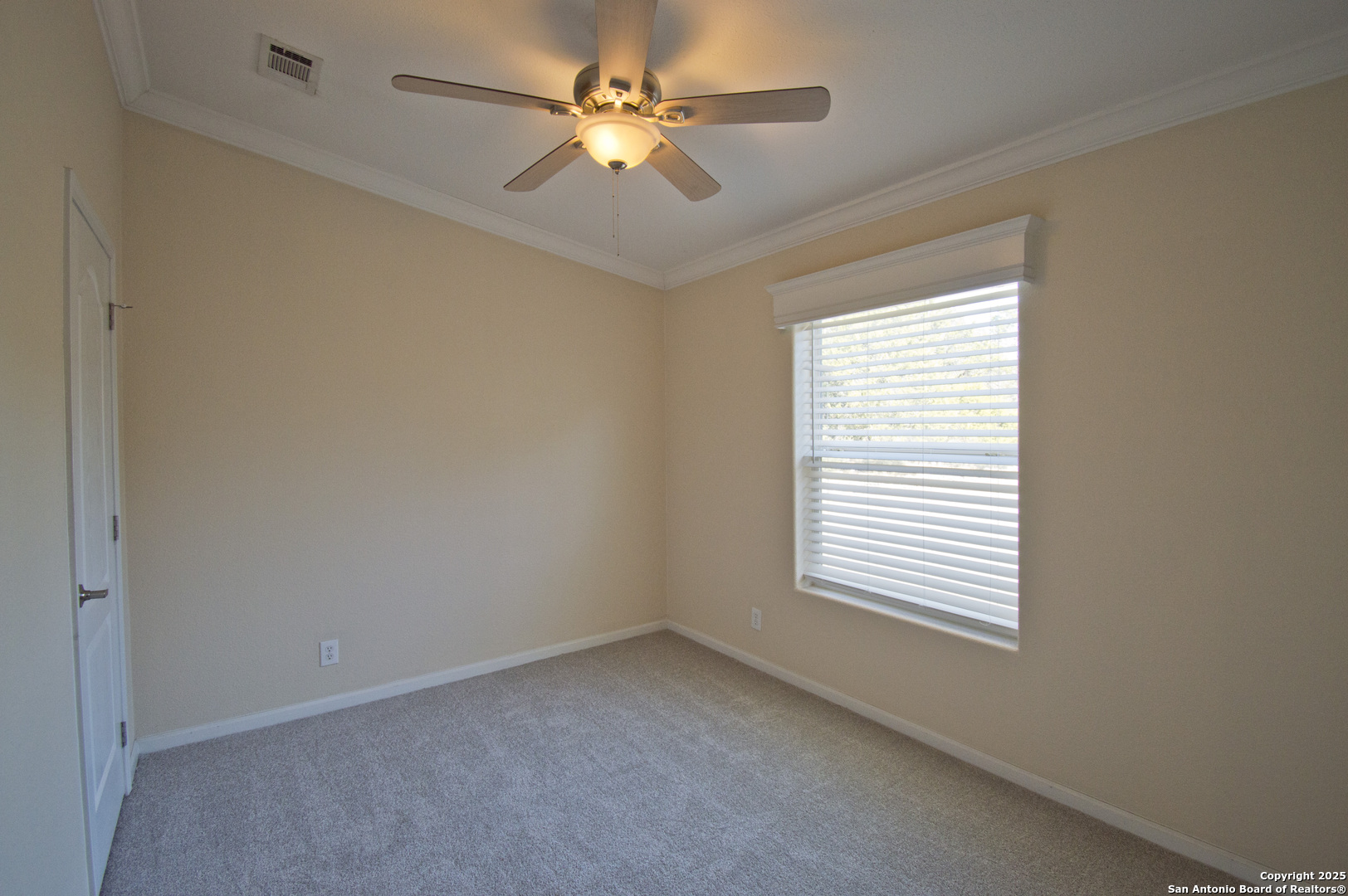 108 Fawn Drive Spring Branch, TX 78070 - Photo 19 of 31 an empty room with windows and fan