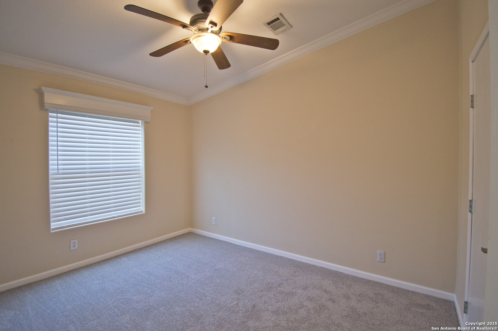 108 Fawn Drive Spring Branch, TX 78070 - Photo 20 of 31 an empty room with a window and a fan