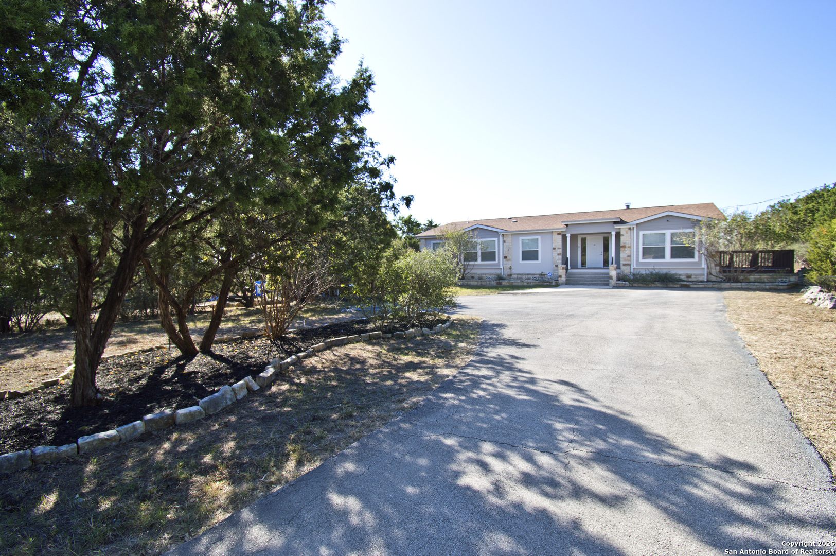 108 Fawn Drive Spring Branch, TX 78070 - Photo 2 of 31 a view of residential houses with yard and trees