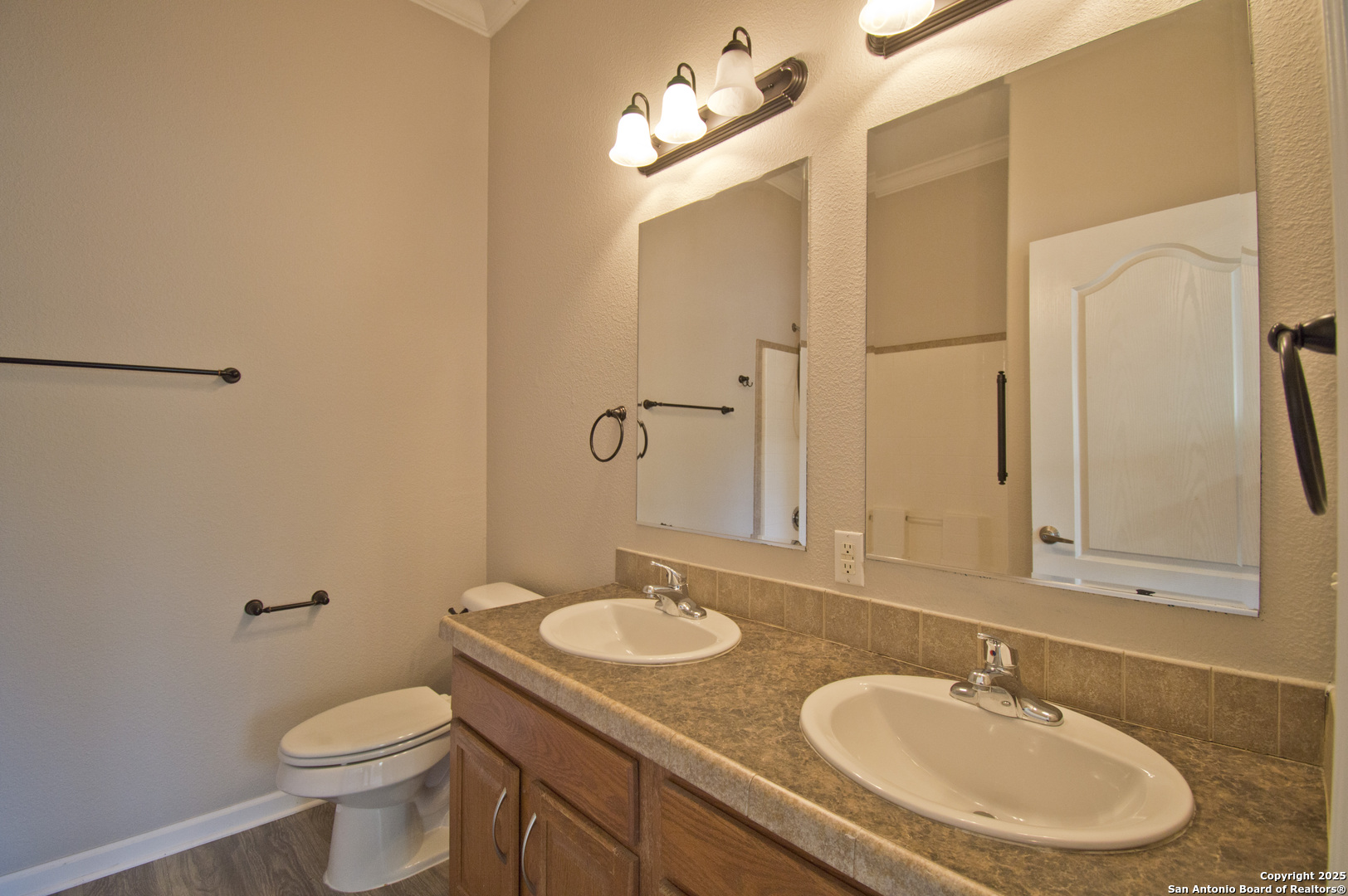 108 Fawn Drive Spring Branch, TX 78070 - Photo 21 of 31 a bathroom with a toilet sink and mirror