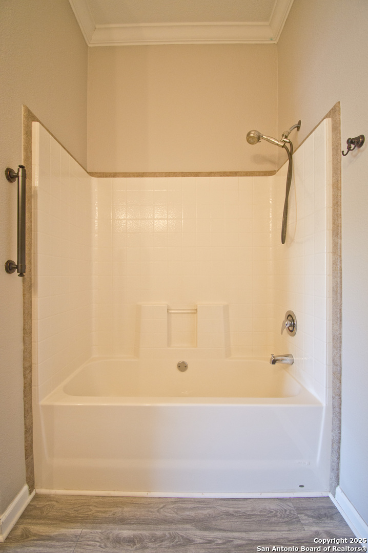 108 Fawn Drive Spring Branch, TX 78070 - Photo 22 of 31 a bathroom with a shower and a bath tub