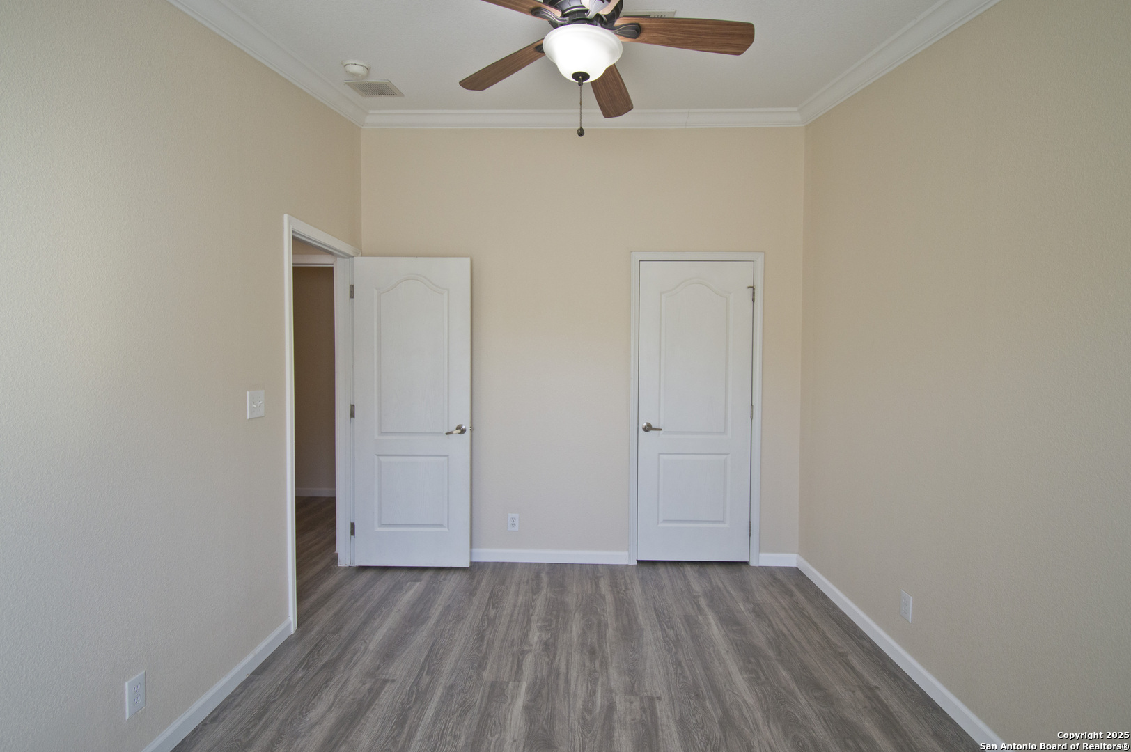 108 Fawn Drive Spring Branch, TX 78070 - Photo 24 of 31 an empty room with wooden floor fan and windows