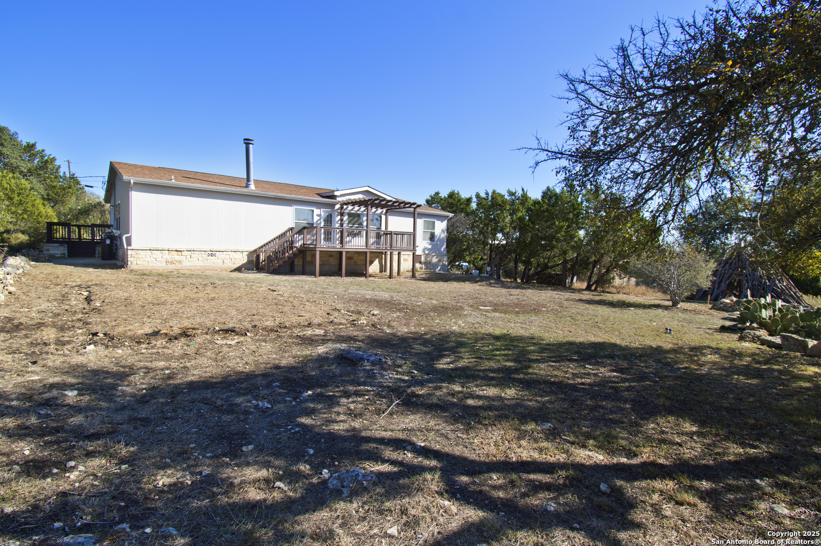 108 Fawn Drive Spring Branch, TX 78070 - Photo 29 of 31 a view of a yard with a large tree
