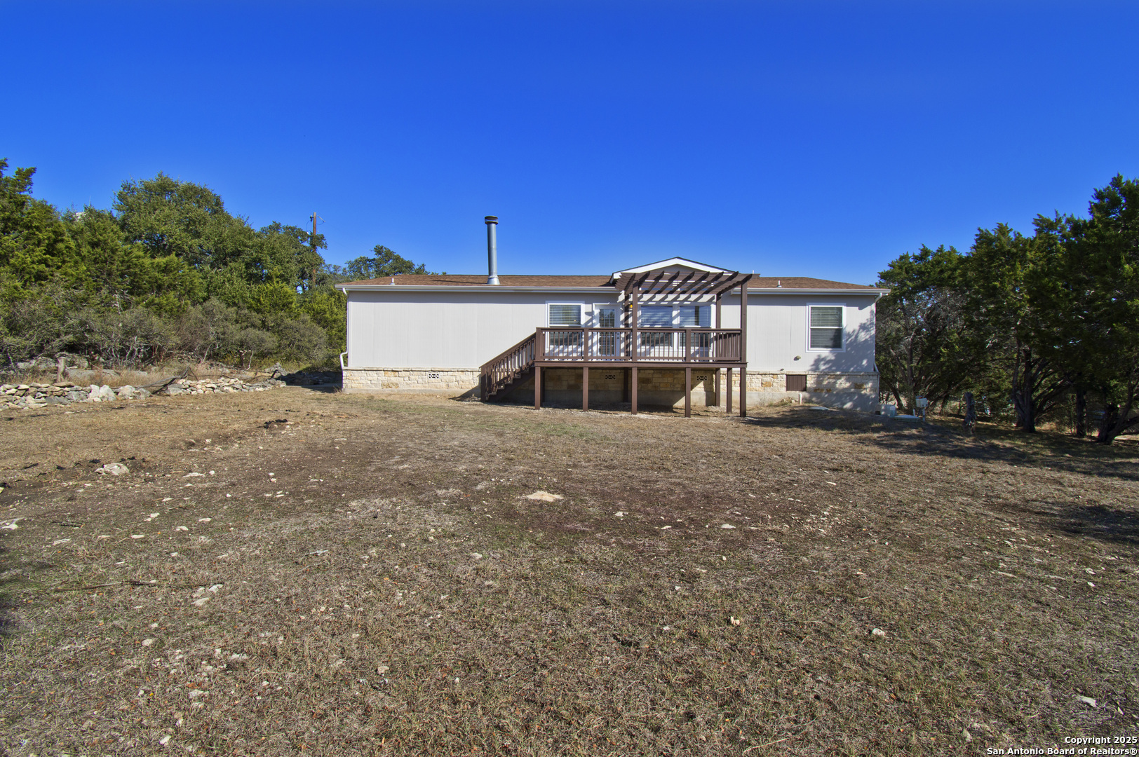 108 Fawn Drive Spring Branch, TX 78070 - Photo 30 of 31 a view of a house with a yard