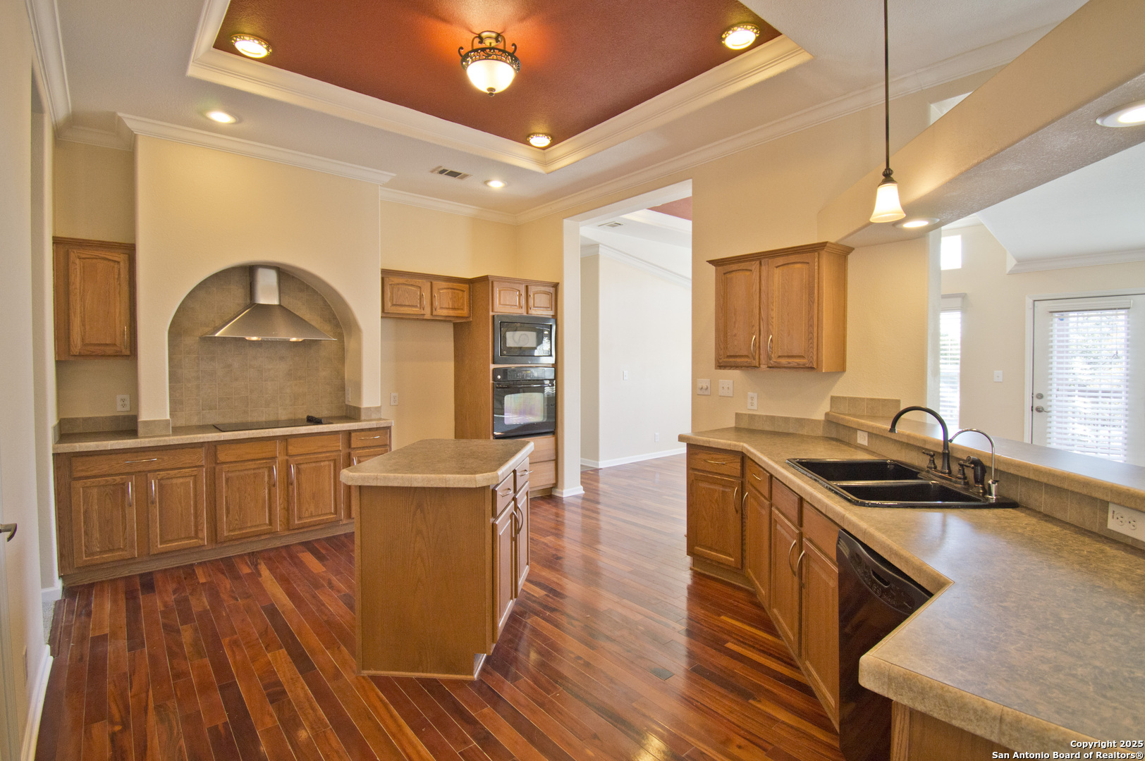 108 Fawn Drive Spring Branch, TX 78070 - Photo 9 of 31 a kitchen with stainless steel appliances granite countertop a stove and a wooden floors