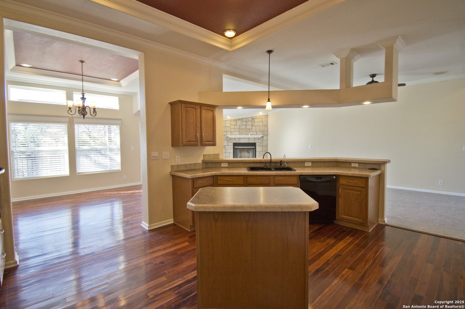 108 Fawn Drive Spring Branch, TX 78070 - Photo 10 of 31 a kitchen with a sink appliances wooden floor and a large window