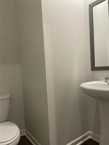 a bathroom with a sink and toilet