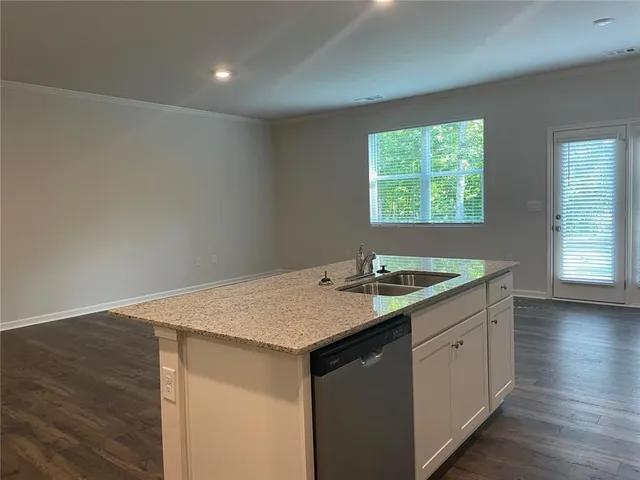 a kitchen with a sink and a window