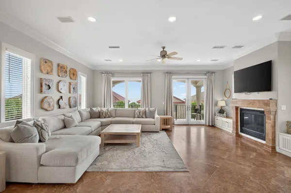 a living room with furniture fireplace and flat screen tv