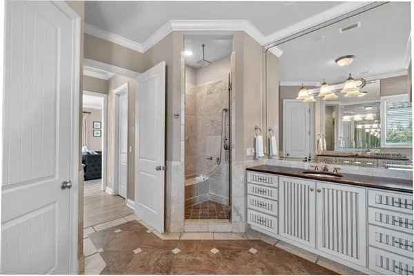 a bathroom with a granite countertop sink a toilet and a mirror