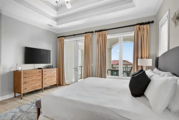 a bathroom with a granite countertop double vanity sink and a mirror