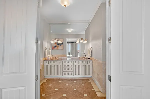 a bathroom with a granite countertop shower and a window
