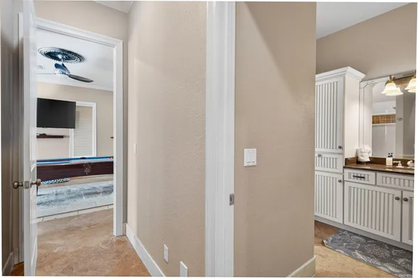 a kitchen with stainless steel appliances granite countertop a refrigerator a stove and a white cabinets