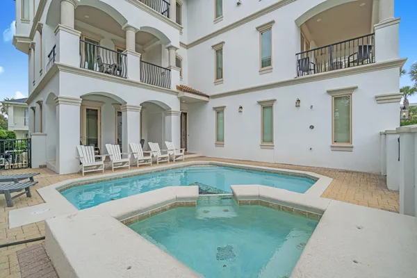 a view of a house with swimming pool