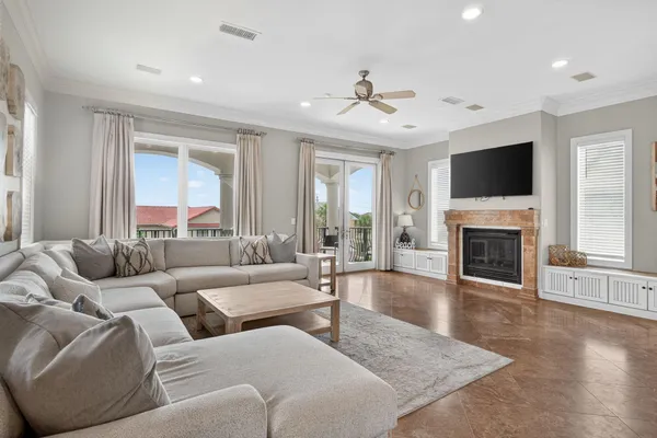 a living room with furniture fireplace and flat screen tv