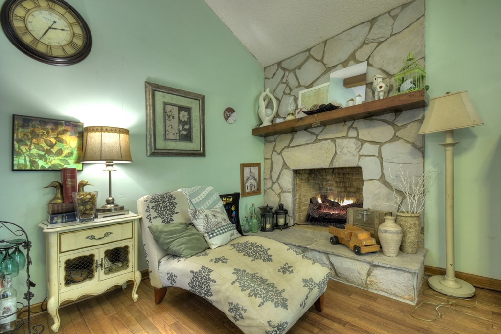 1359 Salem Road Mineral Bluff, GA 30559 - Photo 6 of 18 a bedroom with a bed a mirror on dresser and a table