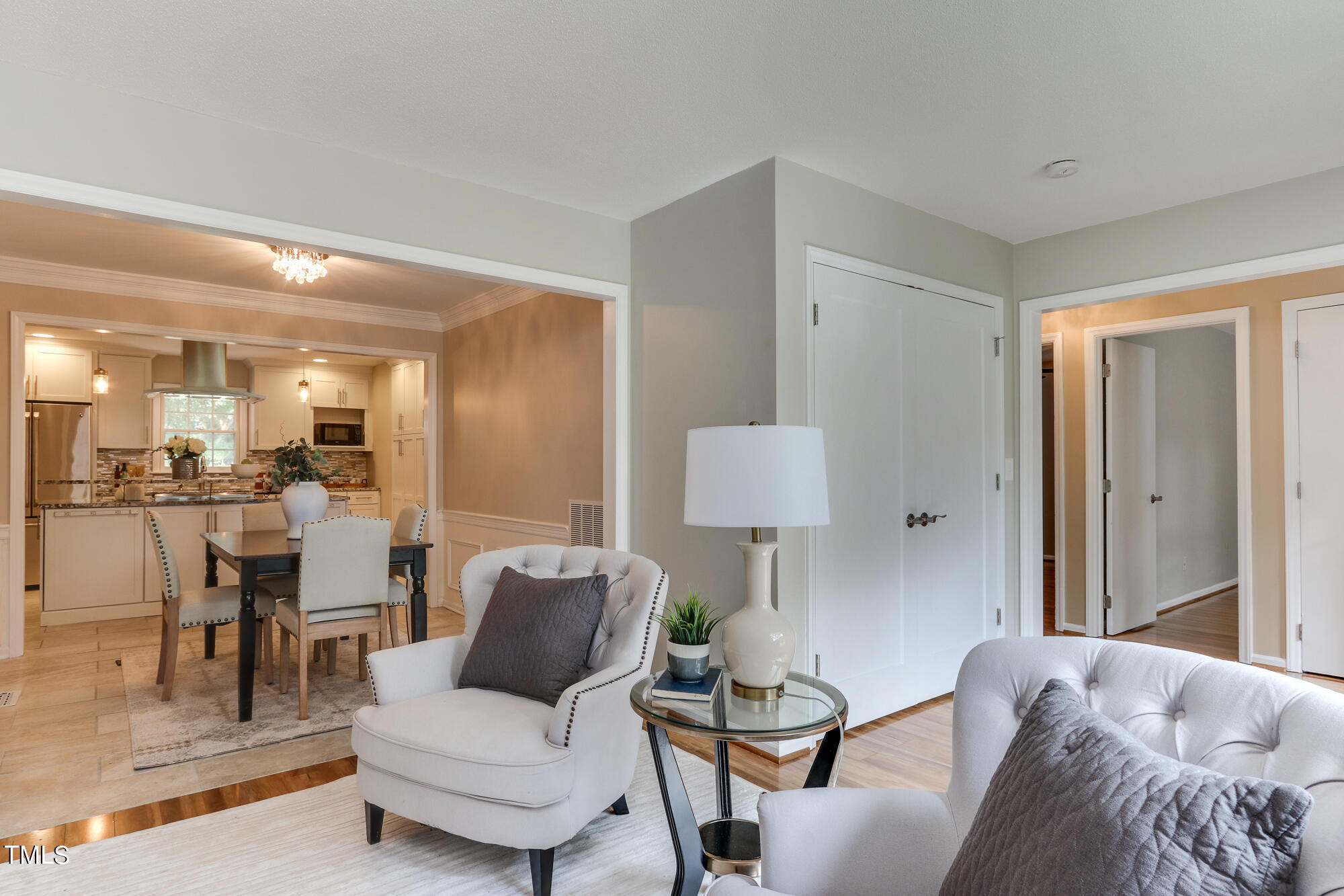 5413 Knollwood Road Raleigh, NC 27609 - Photo 5 of 30 a living room with furniture and a wooden floor