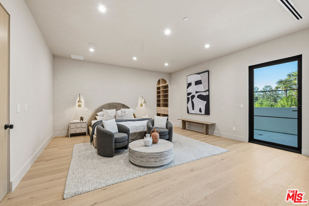 16643 Addison Street Encino, CA 91436 - Photo 15 of 31 a living room with furniture and a window