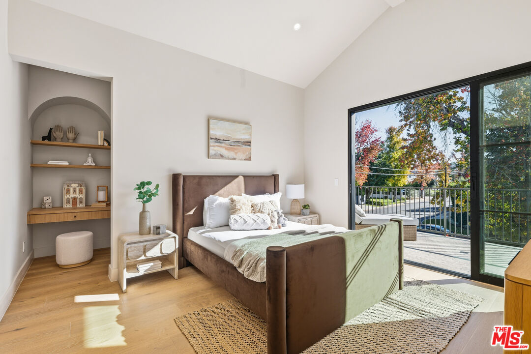 16643 Addison Street Encino, CA 91436 - Photo 24 of 31 a bedroom with a large bed and a window