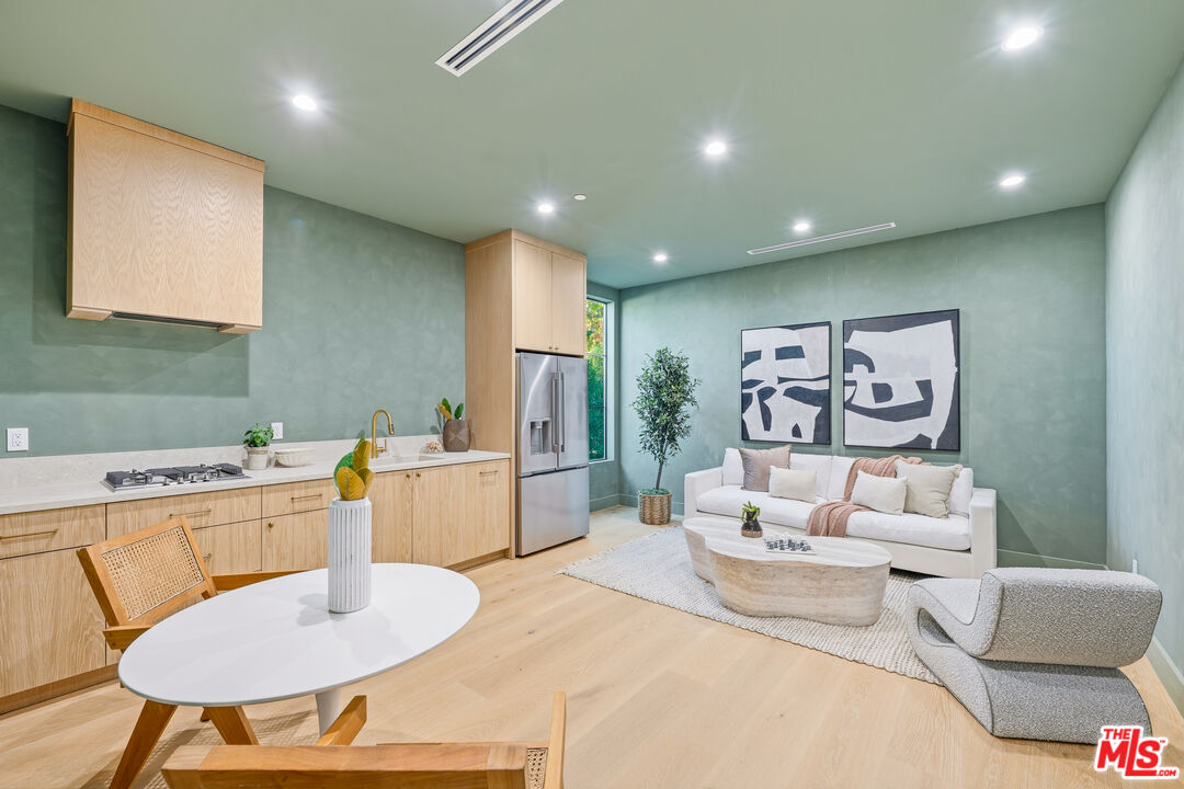 16643 Addison Street Encino, CA 91436 - Photo 28 of 31 a living room with furniture and a table