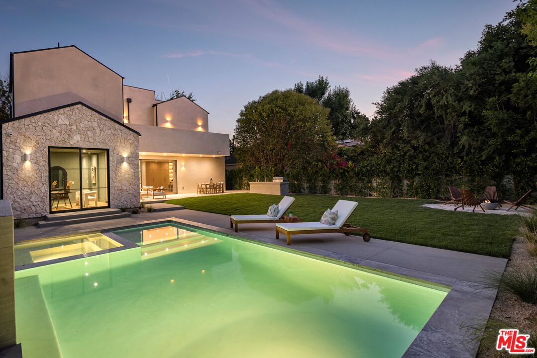 16643 Addison Street Encino, CA 91436 - Photo 31 of 31 a view of a house with pool porch and garden