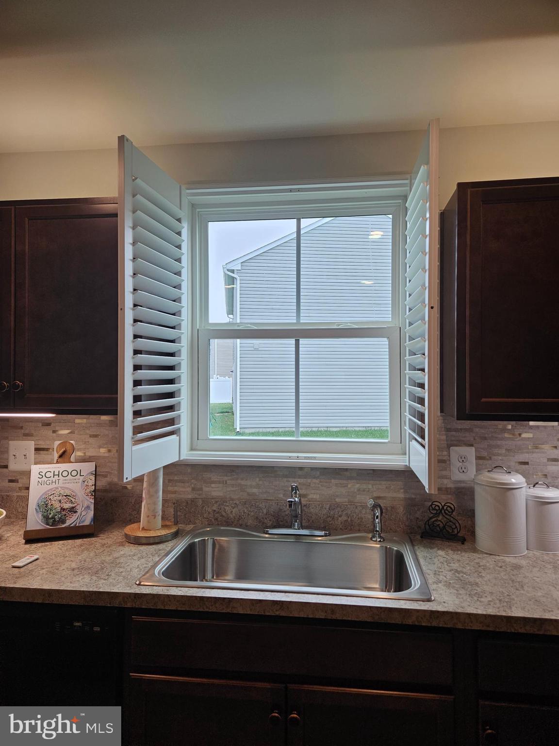 131 Mariners Way Cambridge, MD 21613 - Photo 11 of 28 Custom louvered blinds in kitchen and living room