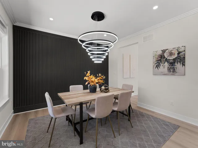 a large kitchen with stainless steel appliances kitchen island granite countertop a refrigerator and a stove top oven