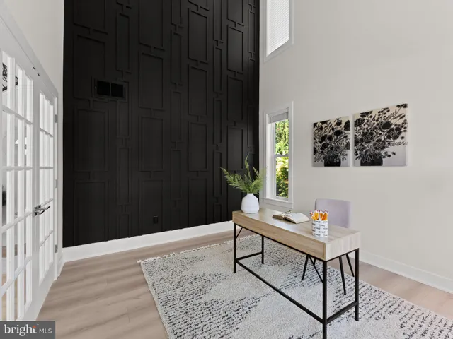 a front view of a house with entryway and wooden floor