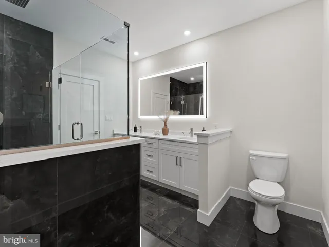 a view of room with wooden floor