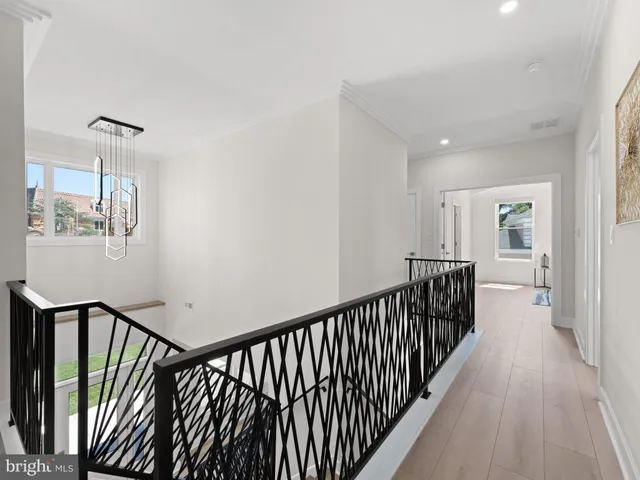 a front view of house with yard and trees in the background