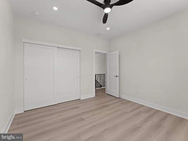 an aerial view of a house with a garden and swimming pool