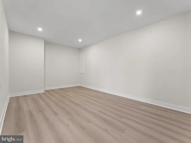 an aerial view of a house with garden space and lake view