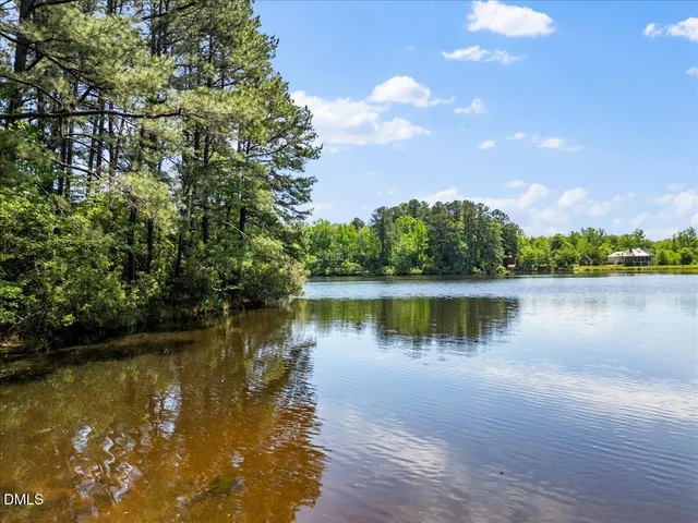 a view of a lake with a yard