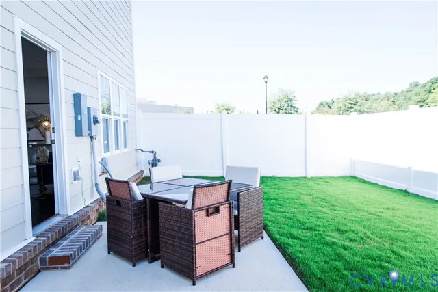 a view of a terrace with furniture and garden