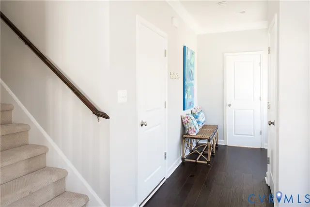 a view of a hallway with chairs and toys