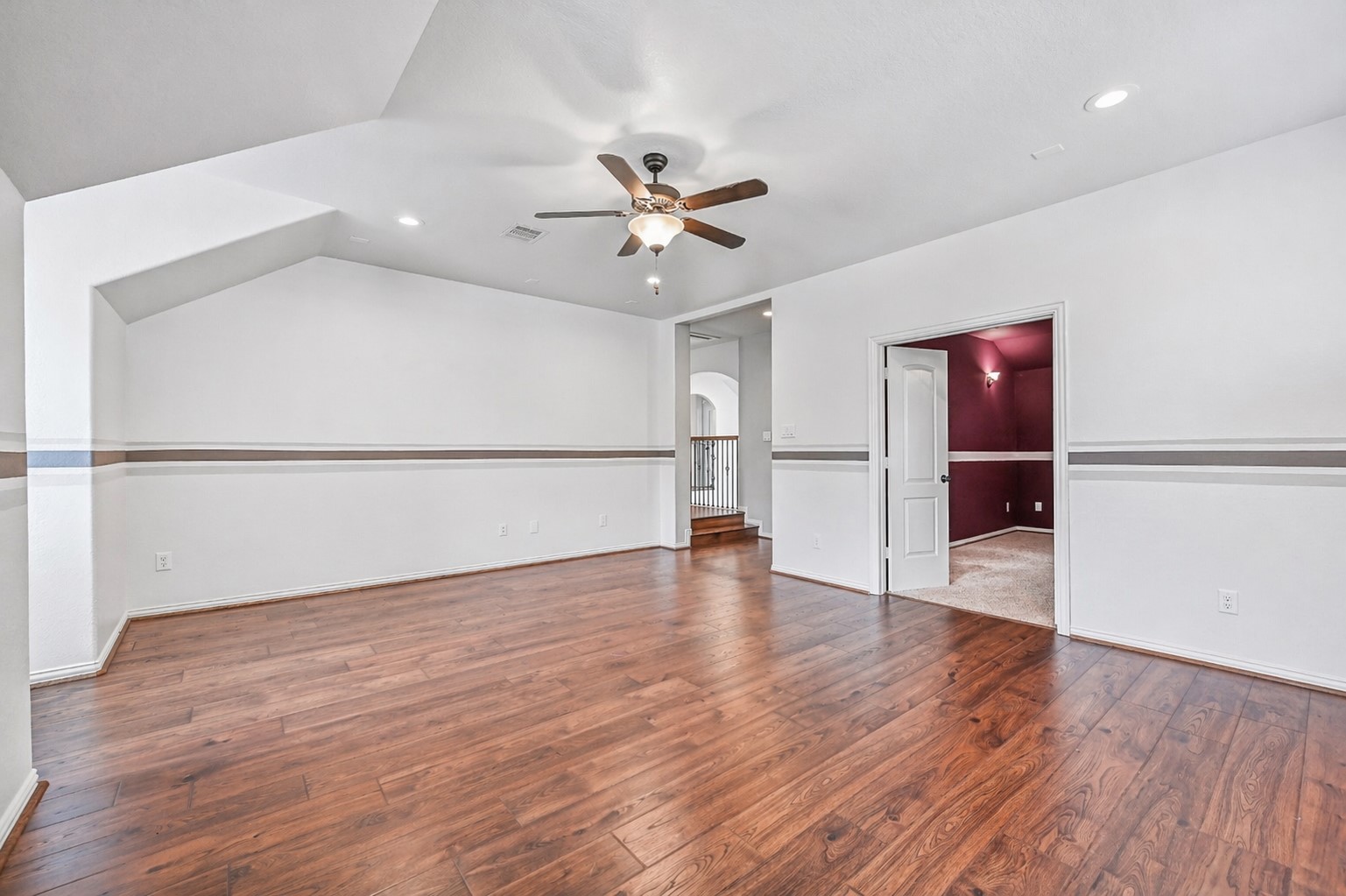1008 Point Isabel Lane Friendswood, TX 77546 - Photo 37 of 50 The gameroom flows seamlessly toward the dedicated media room, creating a well designed second level ideal for entertaining, movie nights, or a private retreat separate from the main living areas.