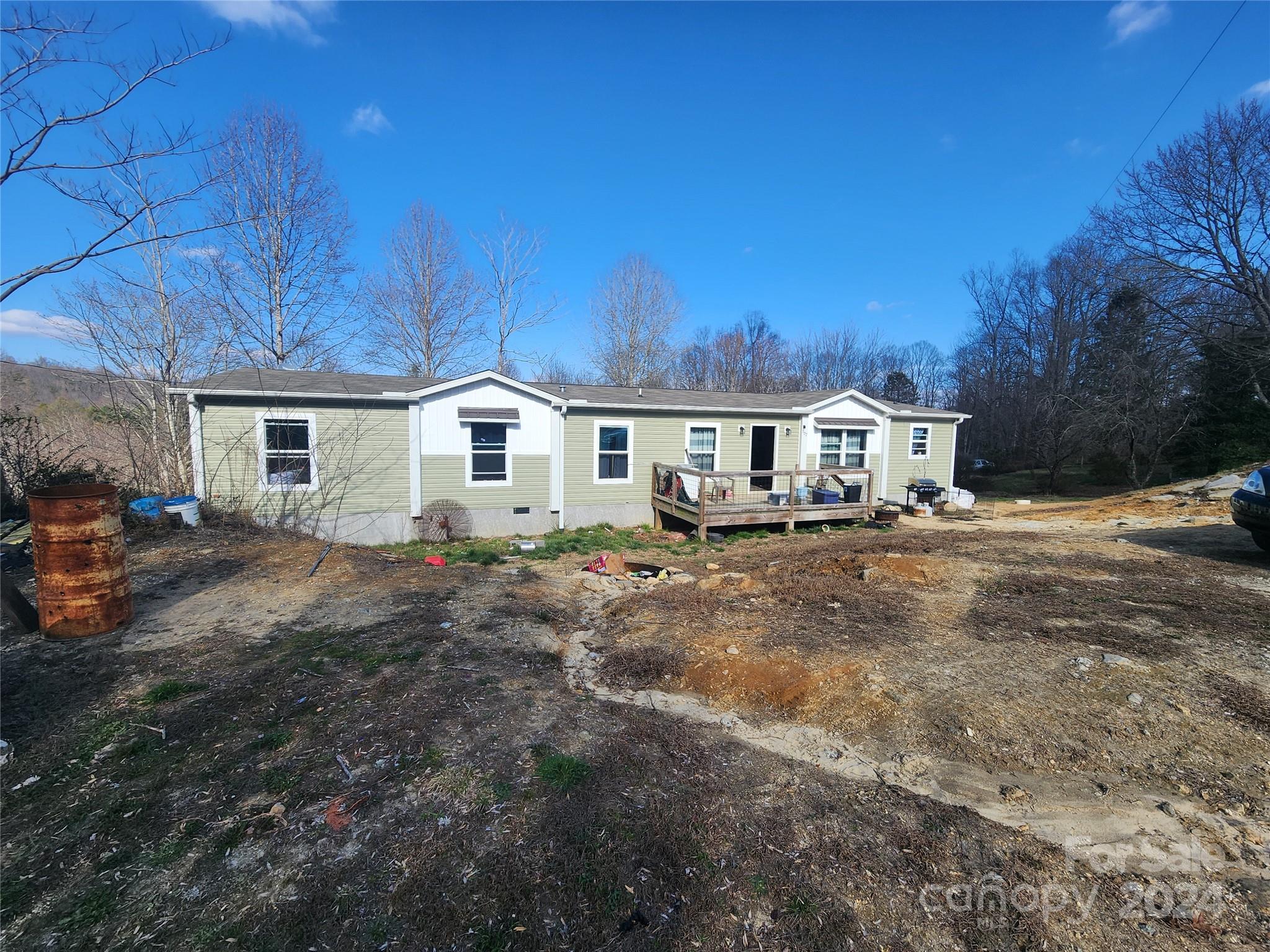 305 Deep Gap Loop Road Flat Rock, NC 28731 - Photo 4 of 7 a view of house with yard and sitting area